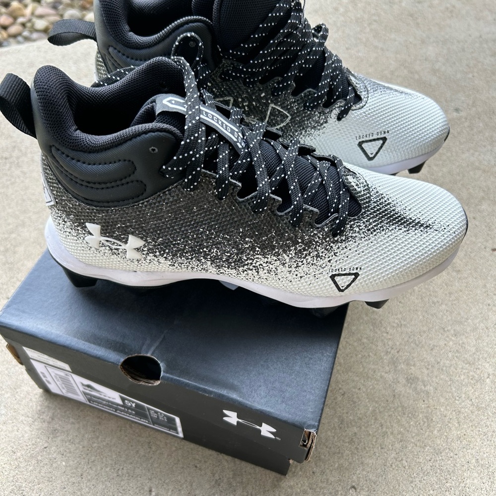 Youth size 5 Under Armour football spikes
